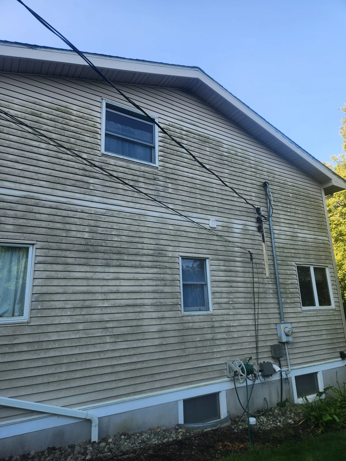 House siding before Kodiak washing